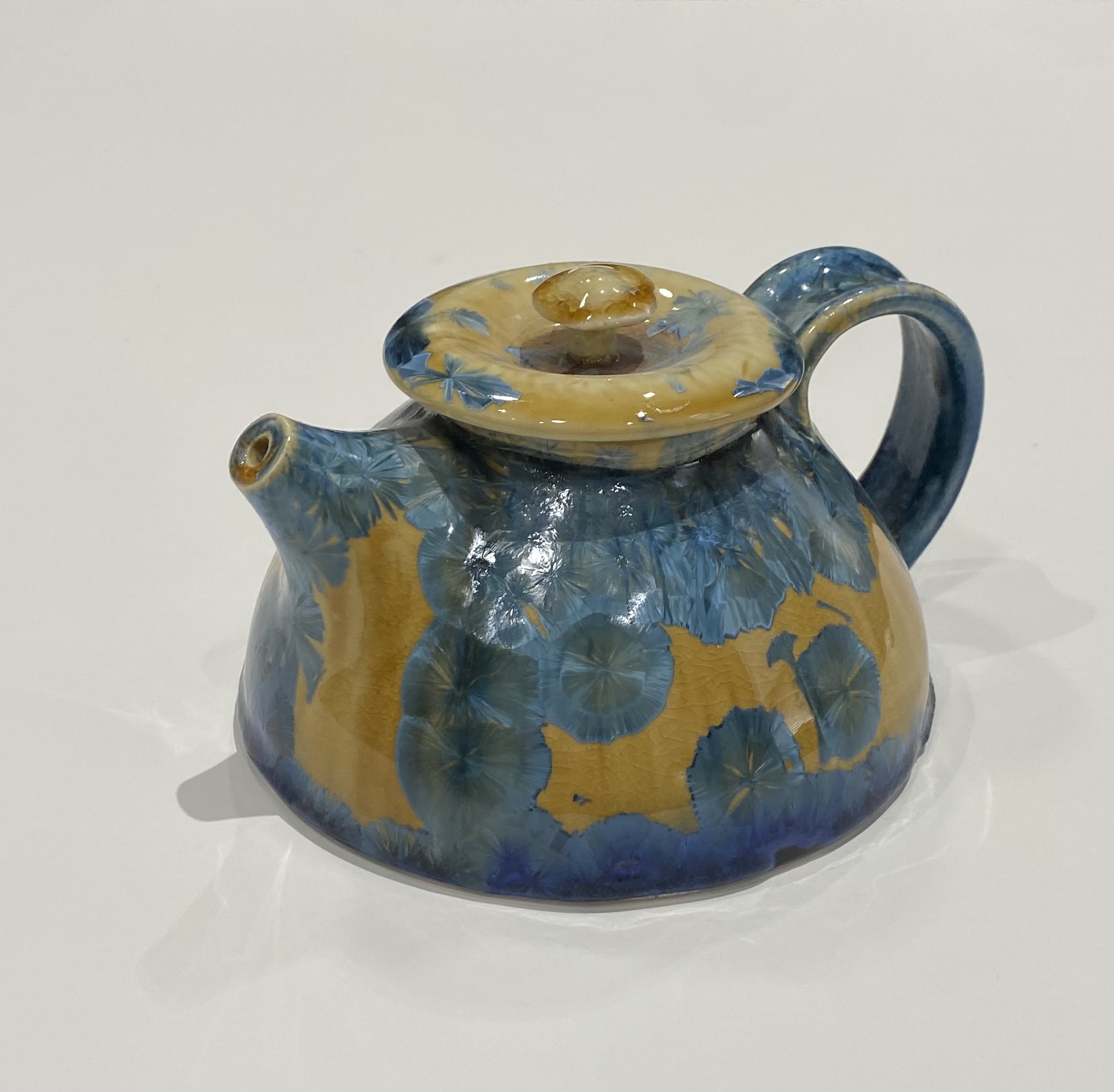 Blue Crystal Teapot
Ceramic/ Porcelain
4" tall
Porcelain
$75.