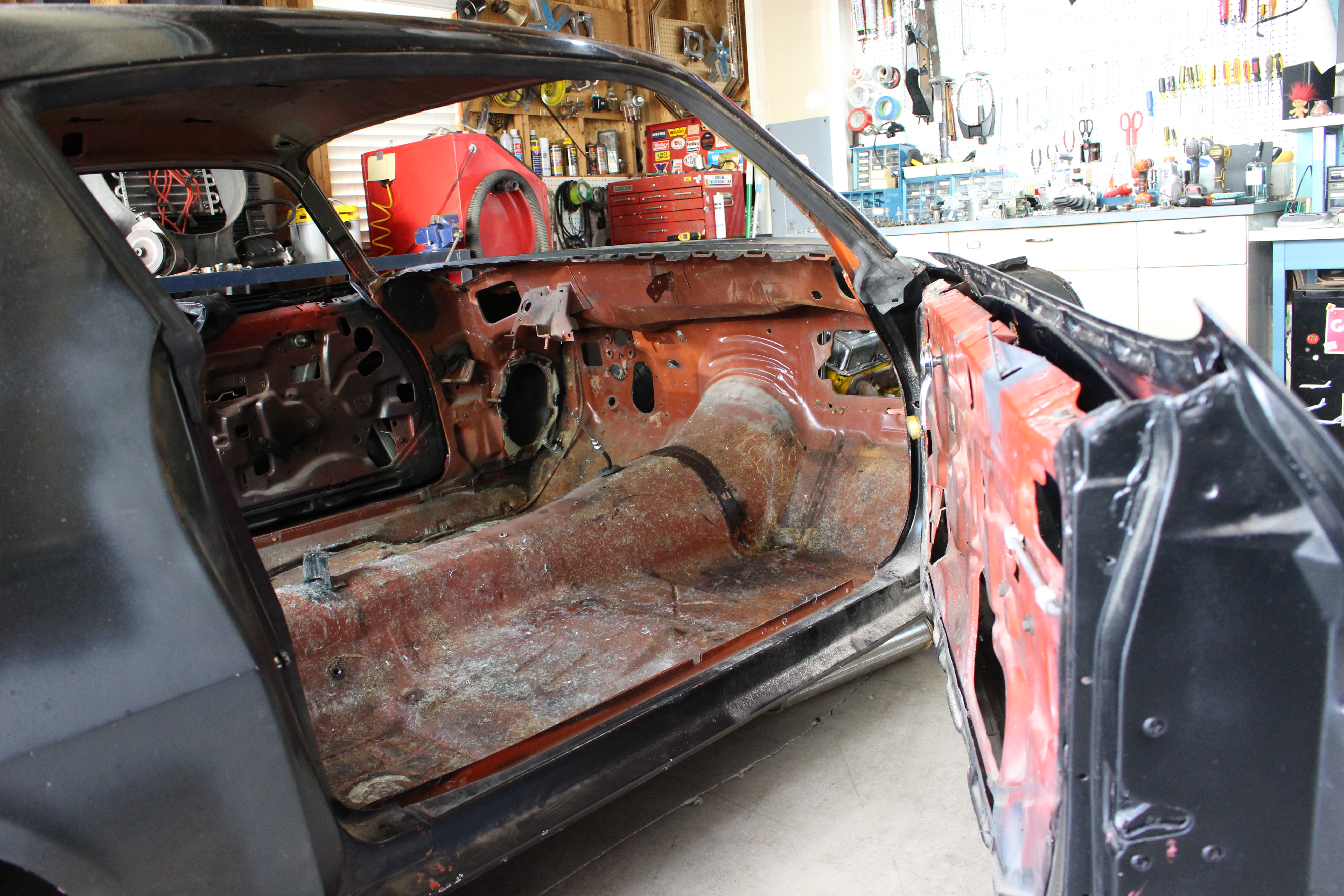 Hole in passenger toeboard was patched with fiberglass in the 80's.