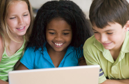 Children typing on computer