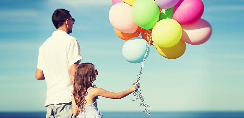 Father and Daughter With Colorful Balloons Father and Daughter With Colorful Balloons