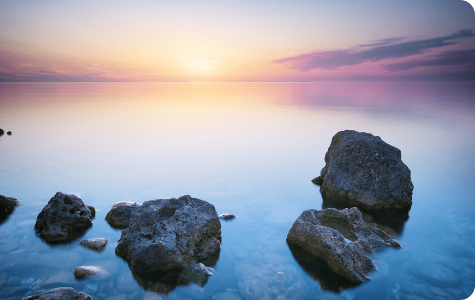 Rocks in calm water with a stunning sunrise. Rocks in calm water with a stunning sunrise.
