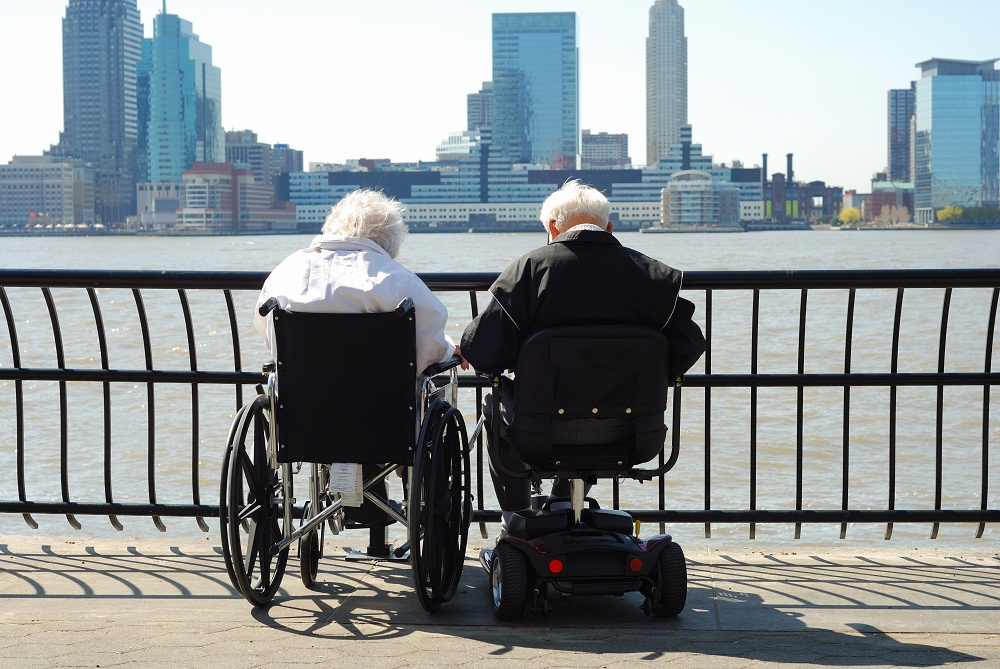 Old Age Couple Sitting on Scooter Lifts