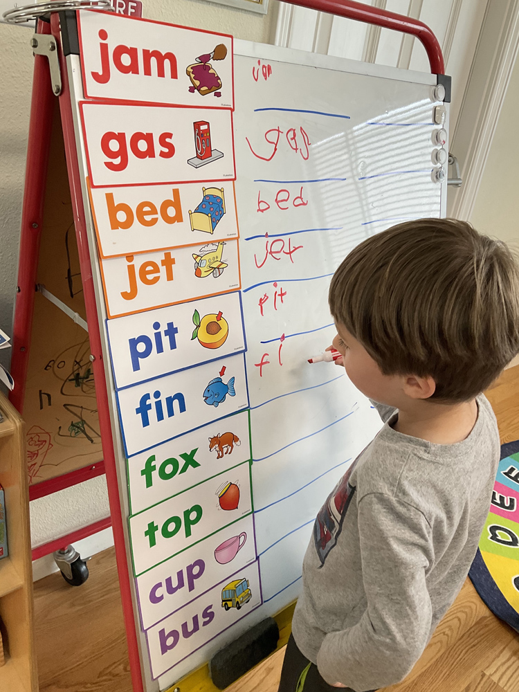 A child learning to write letters