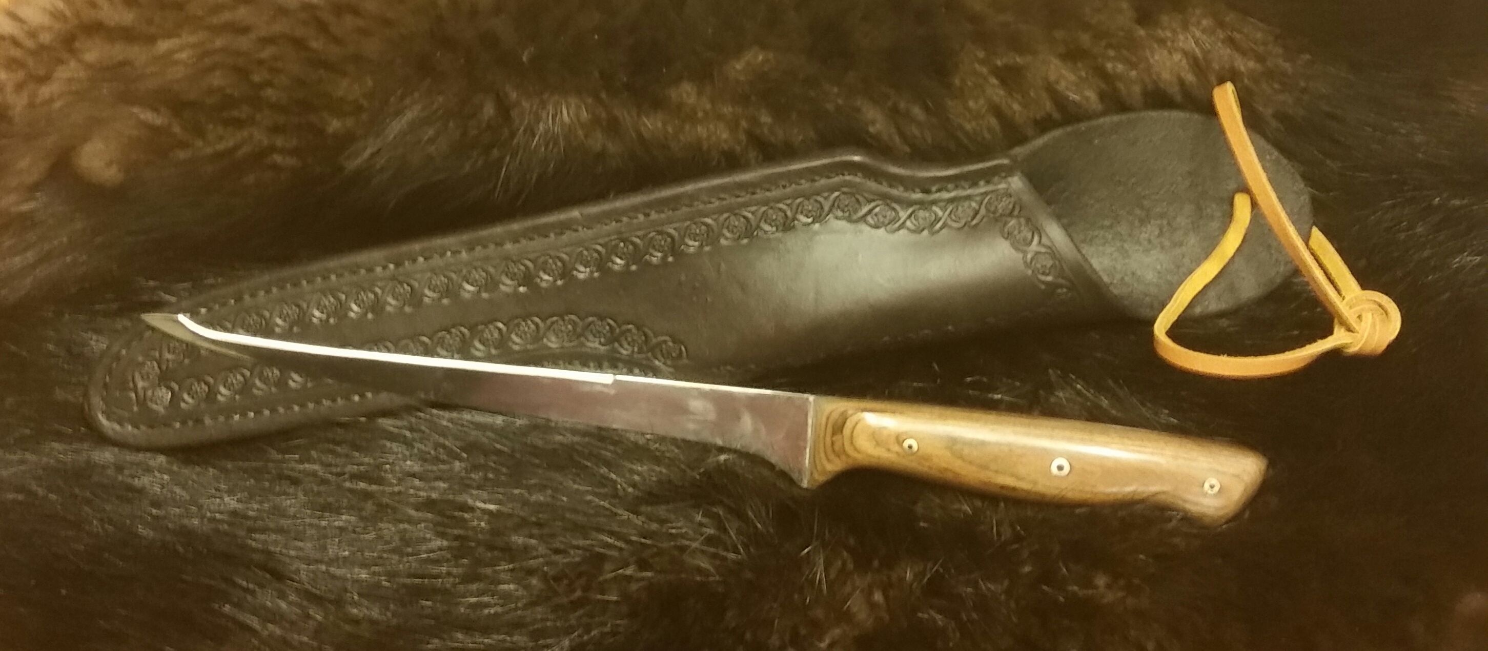 Double Edge Filet Knife with Hand Tooled, Hand Stitched Leather Sheath...  $110.00 