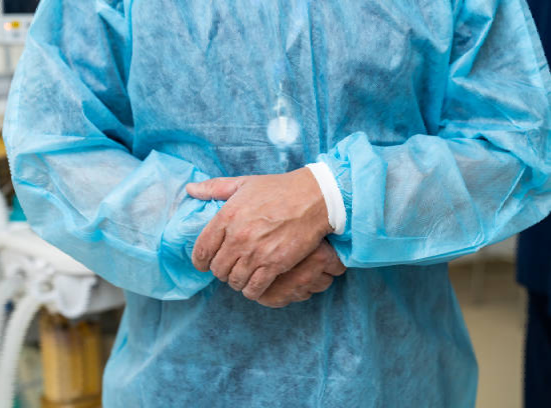 Stack of coins in front of a clock