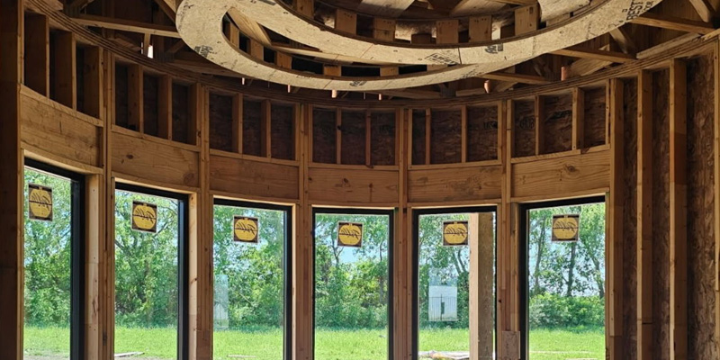 An unfinished room with windows