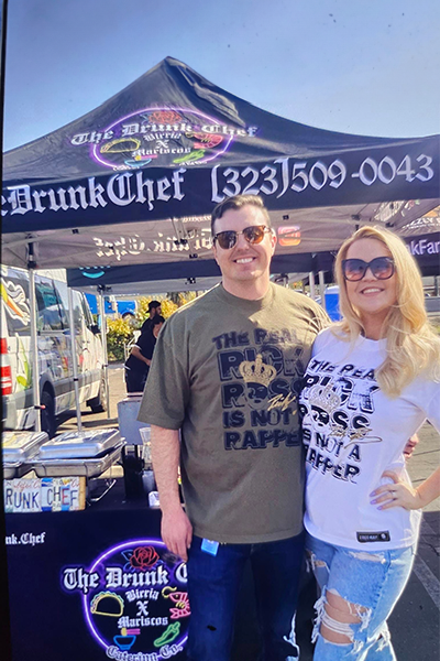 Couple wearing Rick Ross merch