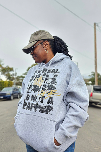 Woman wearing a Rick Ross hoodie