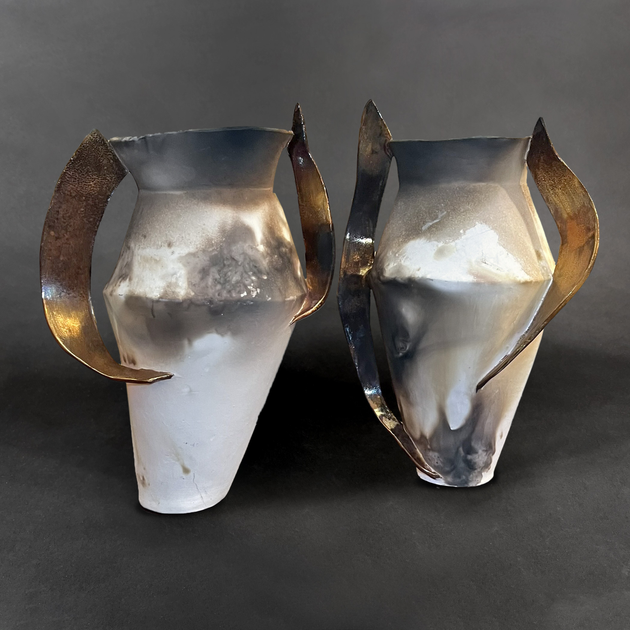 Two Winged Avengers
pit-fired, gold-lustered porcelain
14" h x 18" w x 7" d