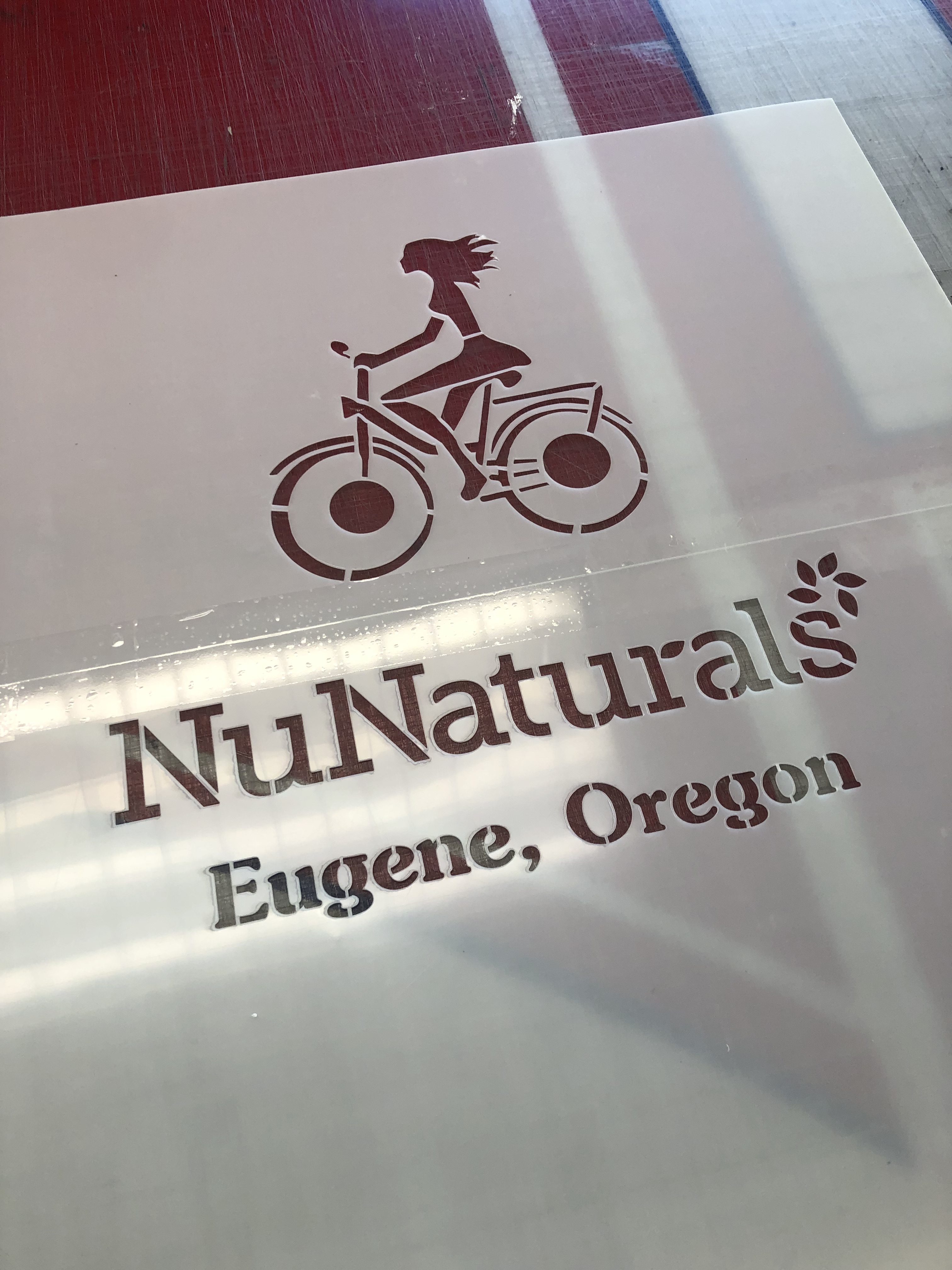 flexible plastic stencil with image of bicycle and text