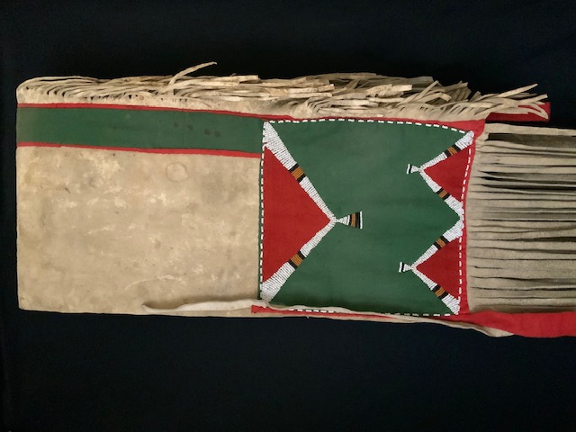  PRODUCT PROFILE :
Product No. :  #11253
Description:  Plateau Saddle 
Horse Throw 
PRODUCT NARRATIVE:
• Native tanned, thick hide, Seed 
beads geometric design in 
pumpkin, white, black. 
Trade cloth in red and green.
• Size: exceptionally long fringe, 
130” overall.
• Circa: 1900
  
