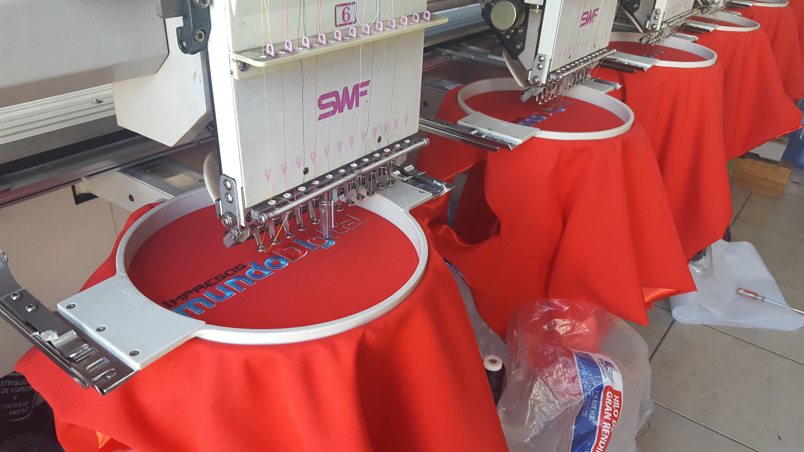 Happy child with glasses holding books and an apple on top