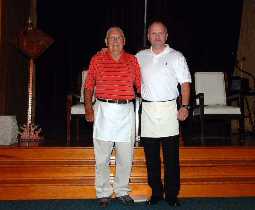 Masonry is a family tradition. Pictured here is a grandfather welcoming a grandson into the fraternity.