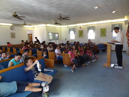 Preaching the Word of God to the children.