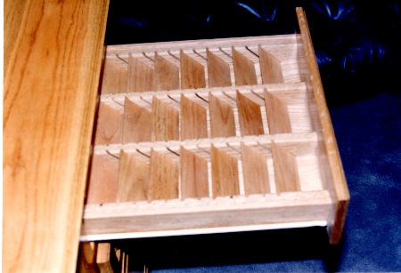 Drawer has adjustable
 dividers for computer storage discs.