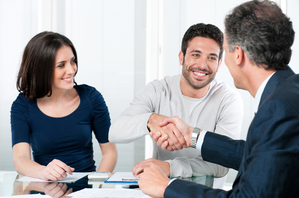 Happy people shaking hands