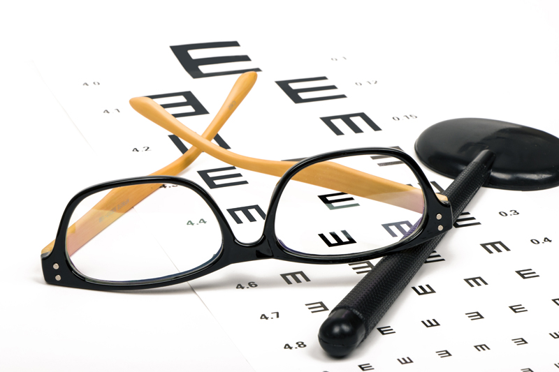 Optometrist chart and eye glasses
