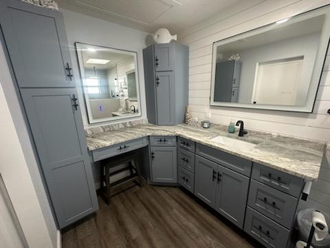 Beautifully done nautical bathroom featuring maple cabinetry painted Dusk blue with custom matte black hardware.