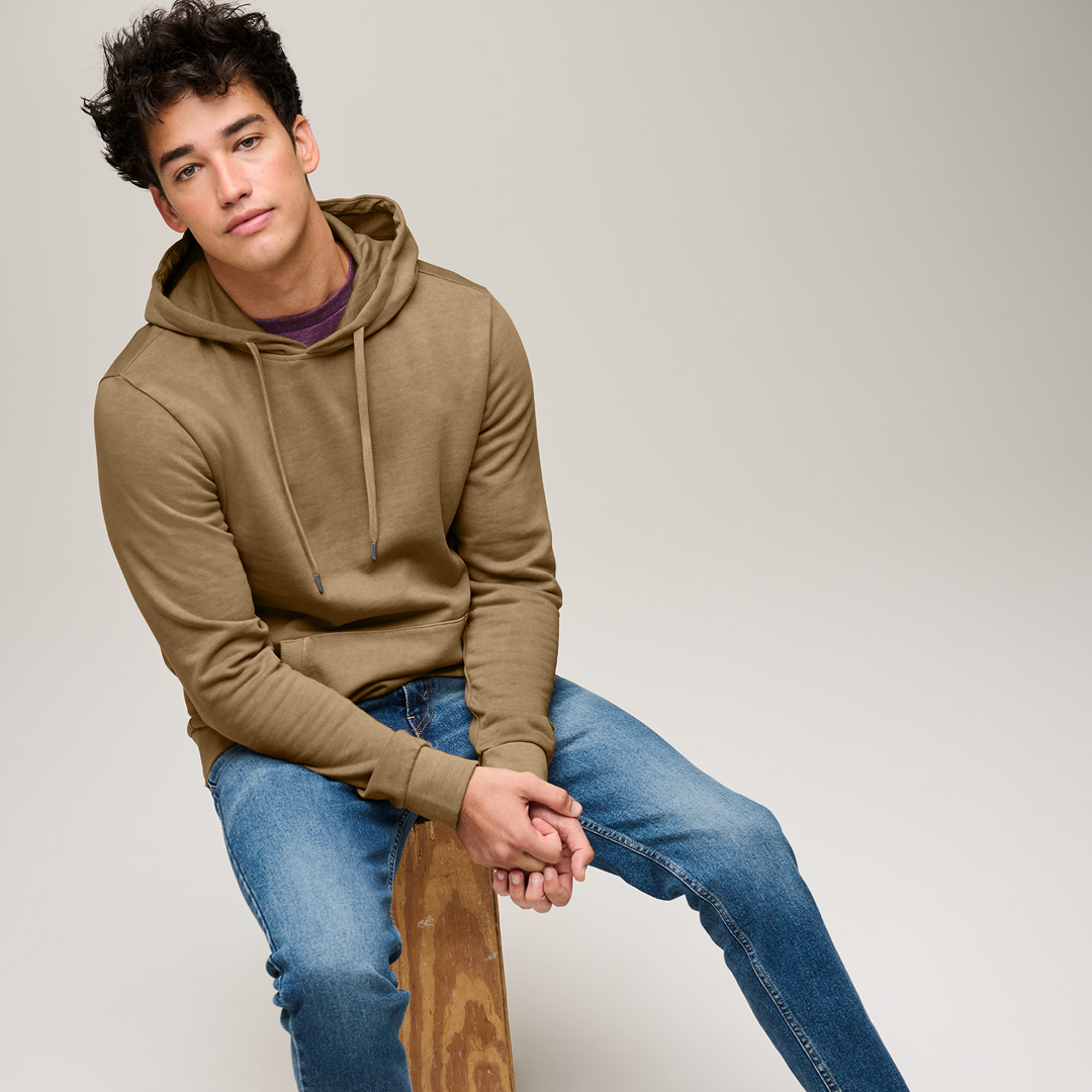 person wearing blue denim bottoms standing