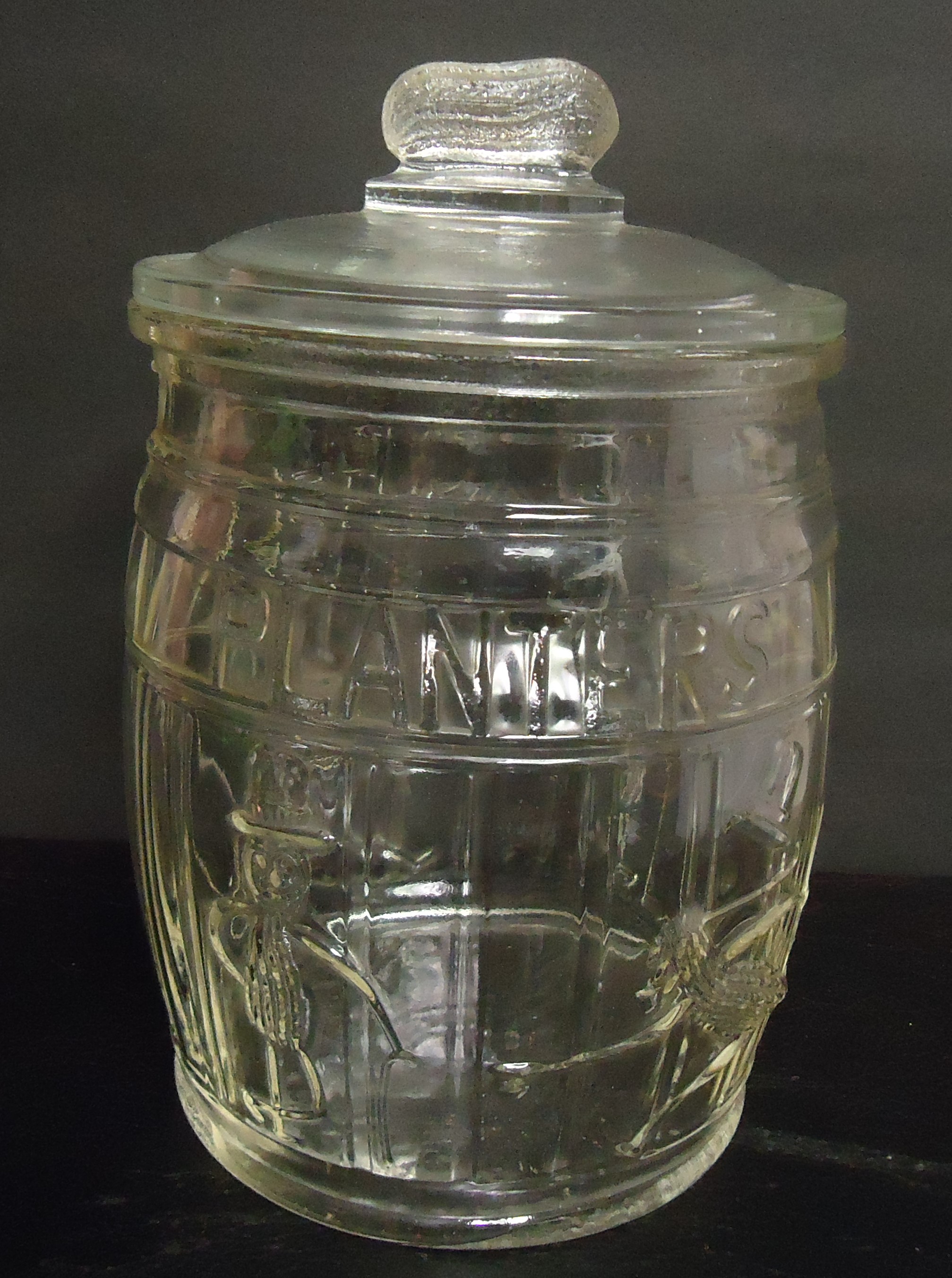 (9) "Planter" Running Man"
Peanut (Clear Glass) Barrel Jar
$75.00