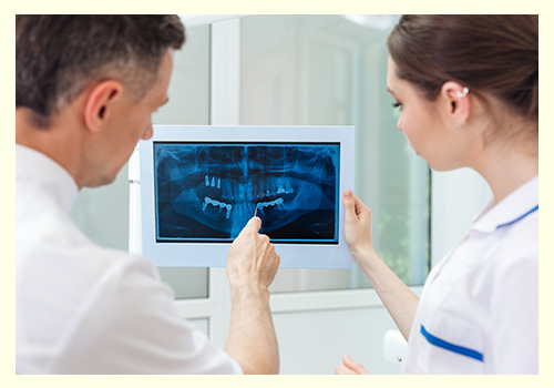 Dentist Showing Something on the Computer Monitor