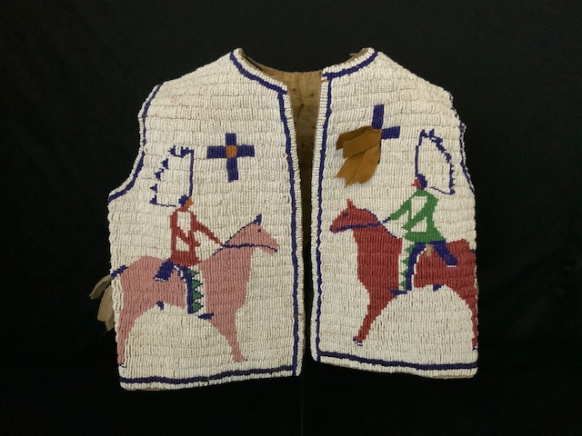 PRODUCT PROFILE :
Product No. : #10042
Description :  Sioux Beaded 
Child's Vest
PRODUCT NARRATIVE :
• Beaded w/ 3 mounted chiefs
• Fully calico cloth inside, ribbons tabs
• Circa: 1880 Size: Length 11" Width 12"
