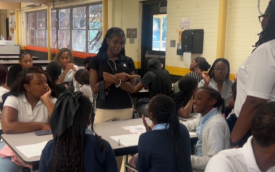 Students participating in a classroom discussion