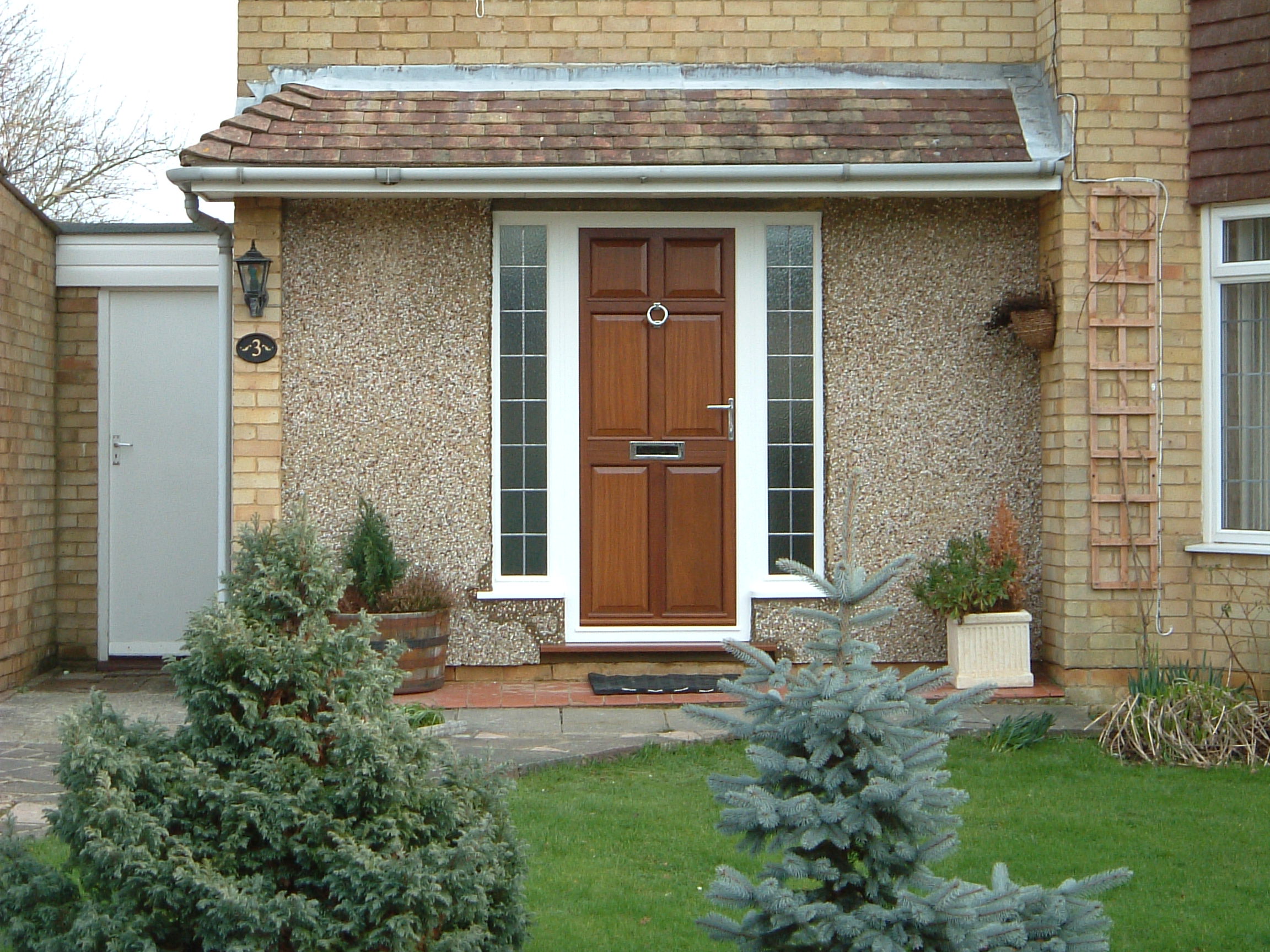 a room with a table chairs and a lamp