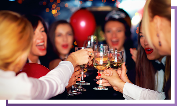 Group Of Happy Elegant Women Clinking Glasses