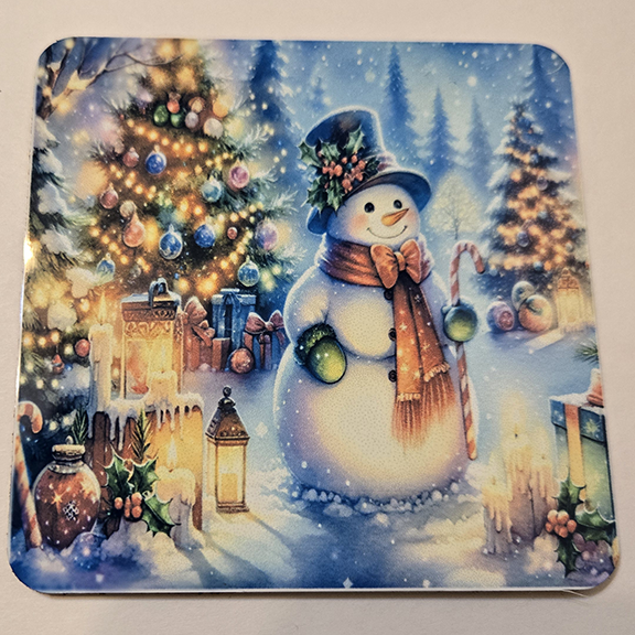 Square metal coaster with a snowman design