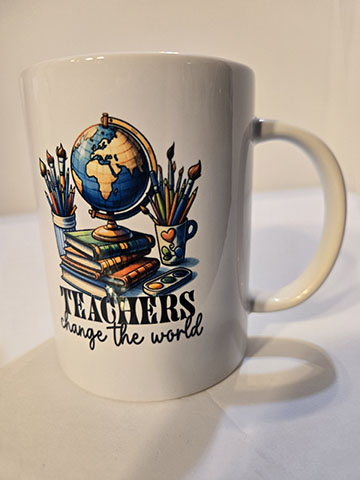 15oz ceramic mug featuring a teachers change the world design