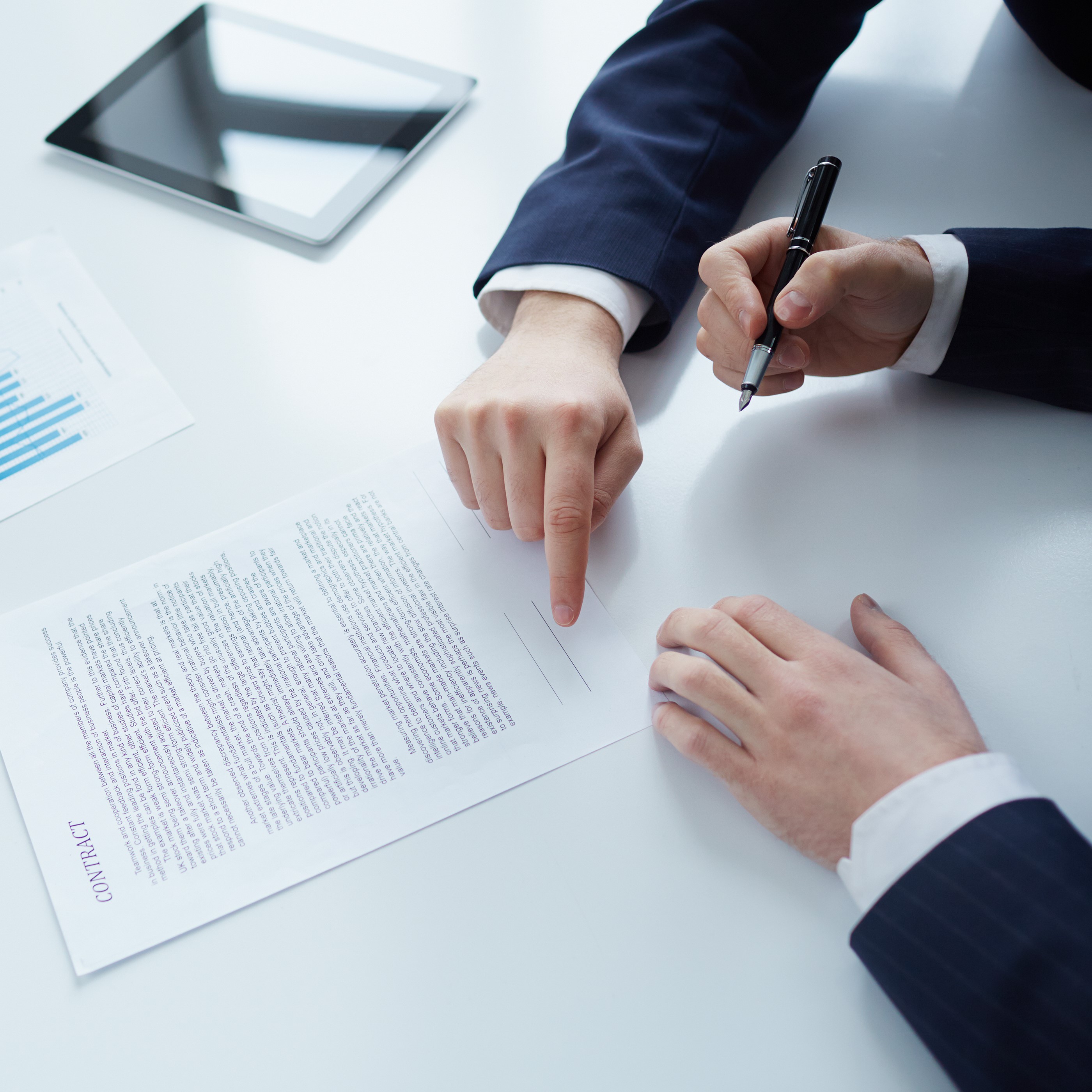 Businessman signing contract on tablet