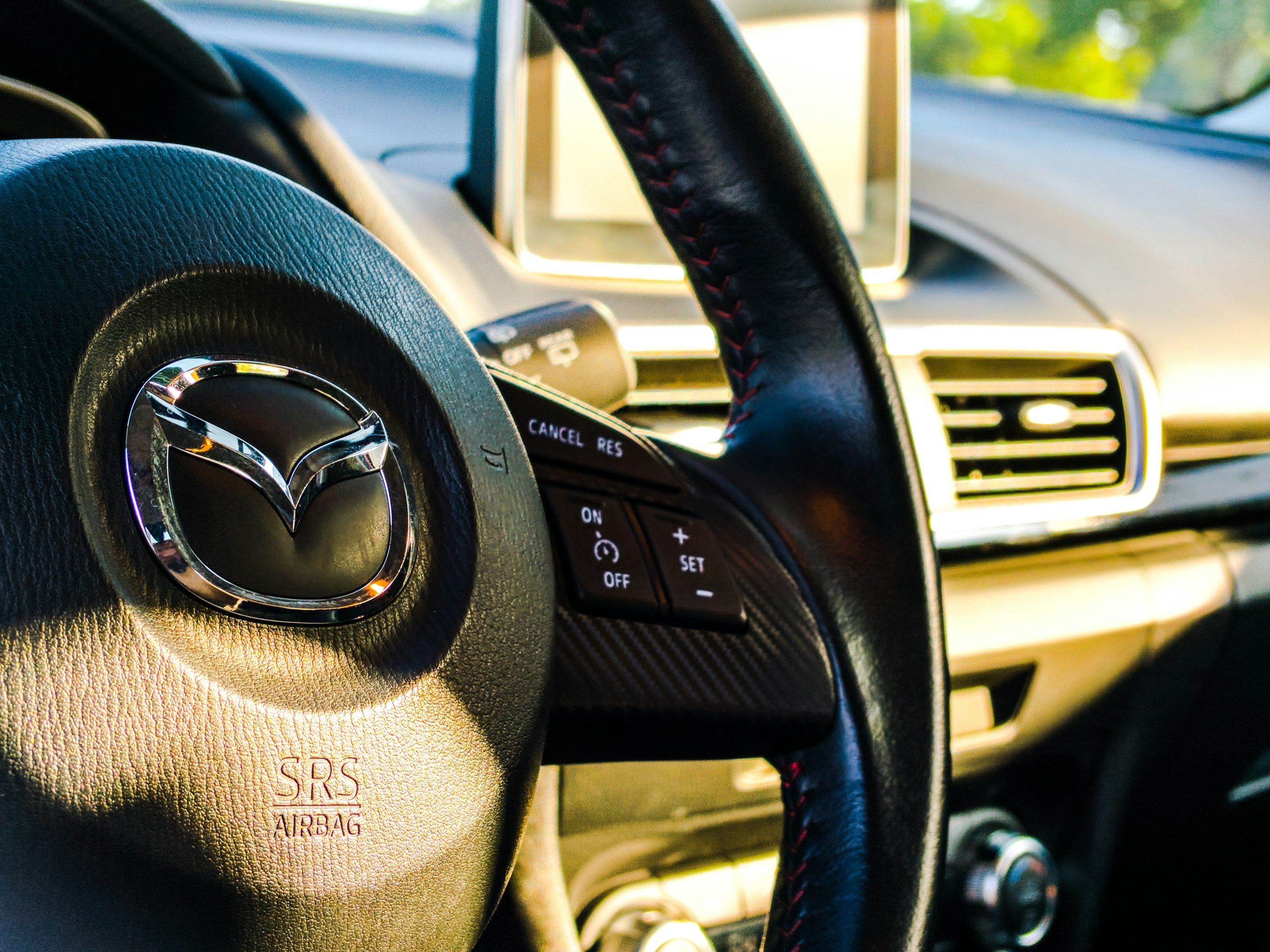 black Mazda steering wheel