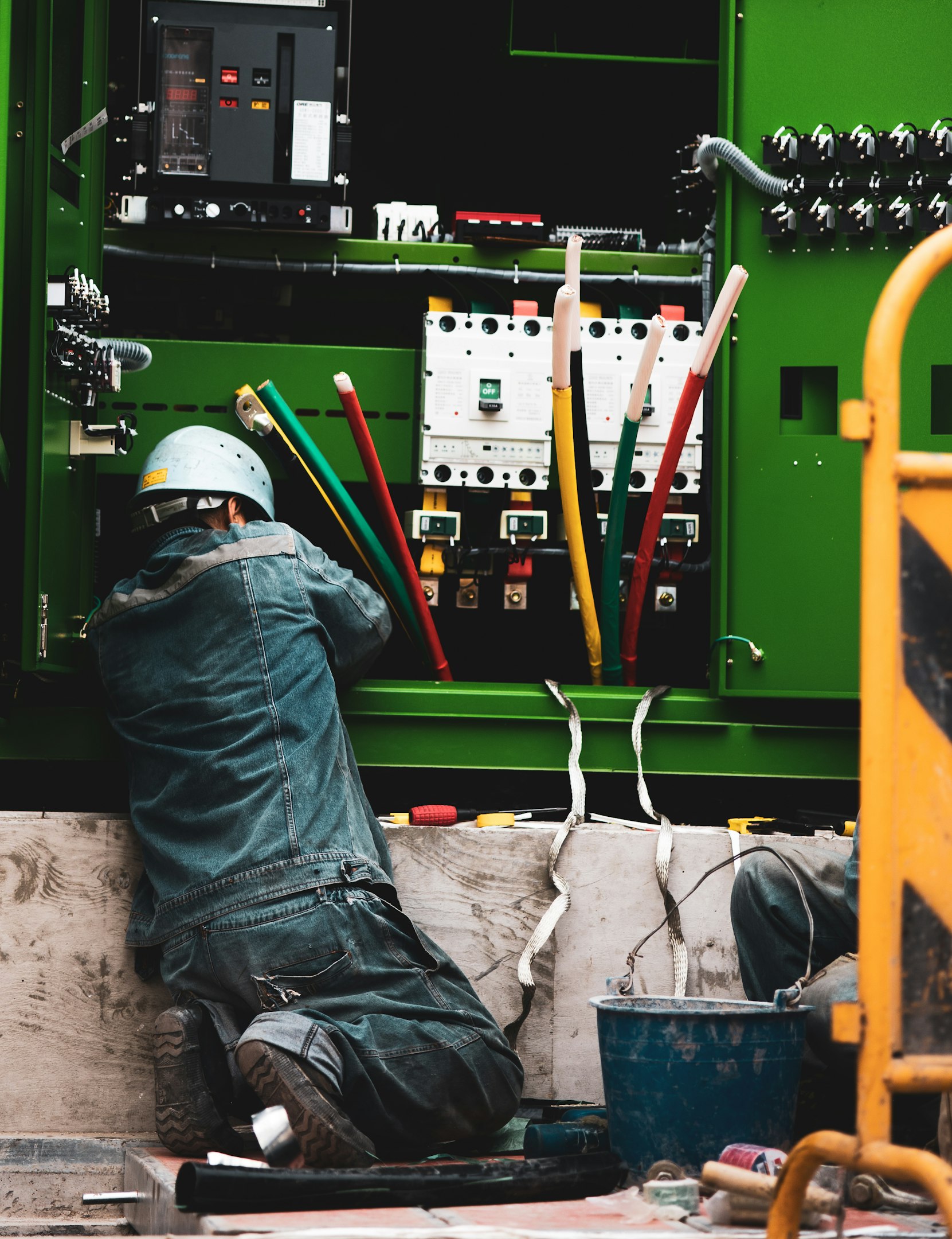 person in blue denim jeans and white helmet