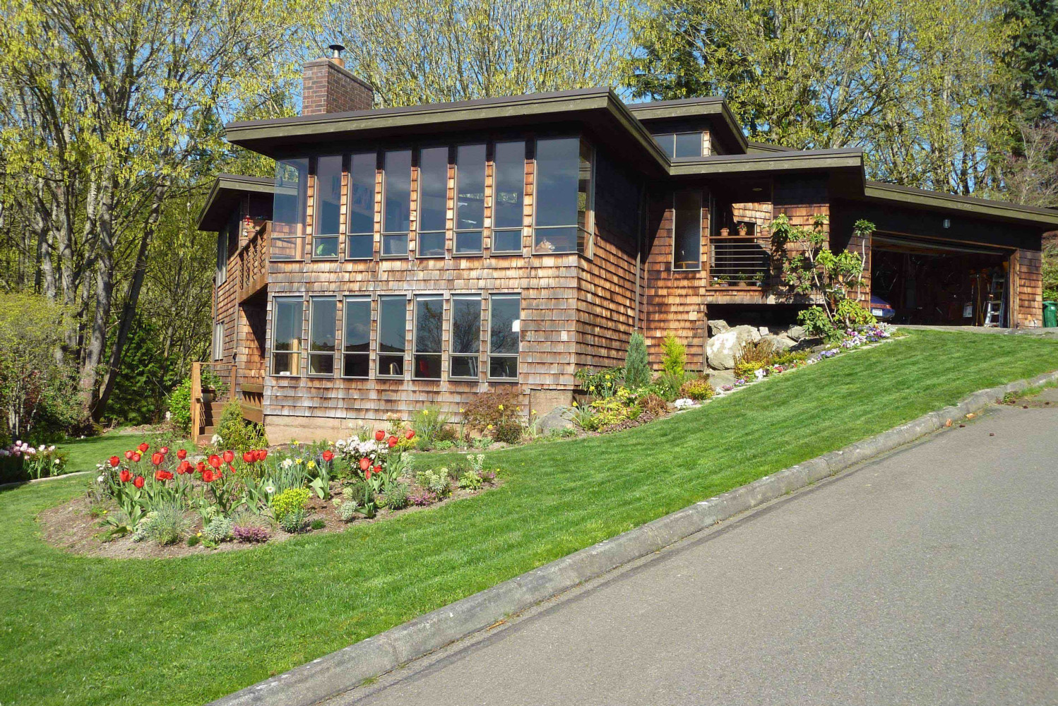 Kirkland Home. Here is the original siding before we demoed it. Take a look at the other picture to see the difference, here you can see the trellis is not there.