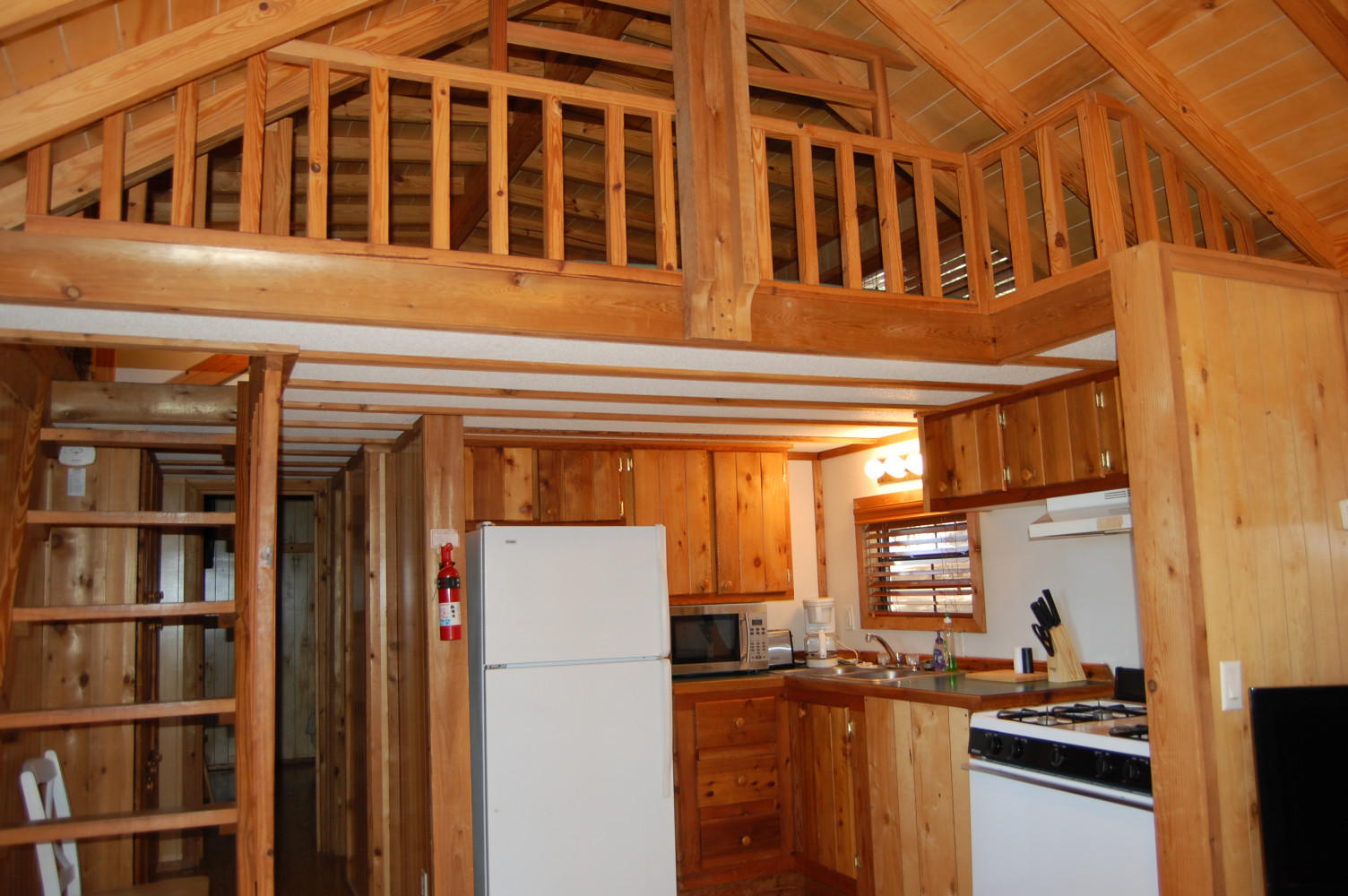 Kitchen and loft of one bedroom cabin