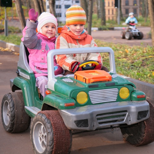 Children In Toy Car