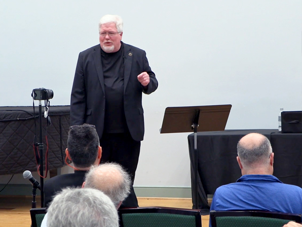 Chuck Thomas speaking to a group. Chuck Thomas speaking to a group.