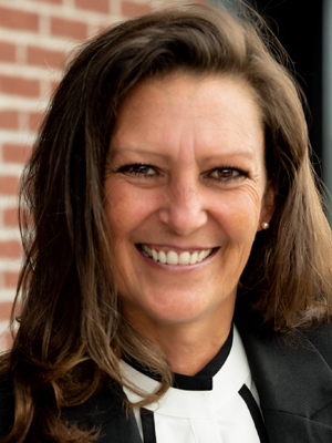 A smiling lady in a white shirt