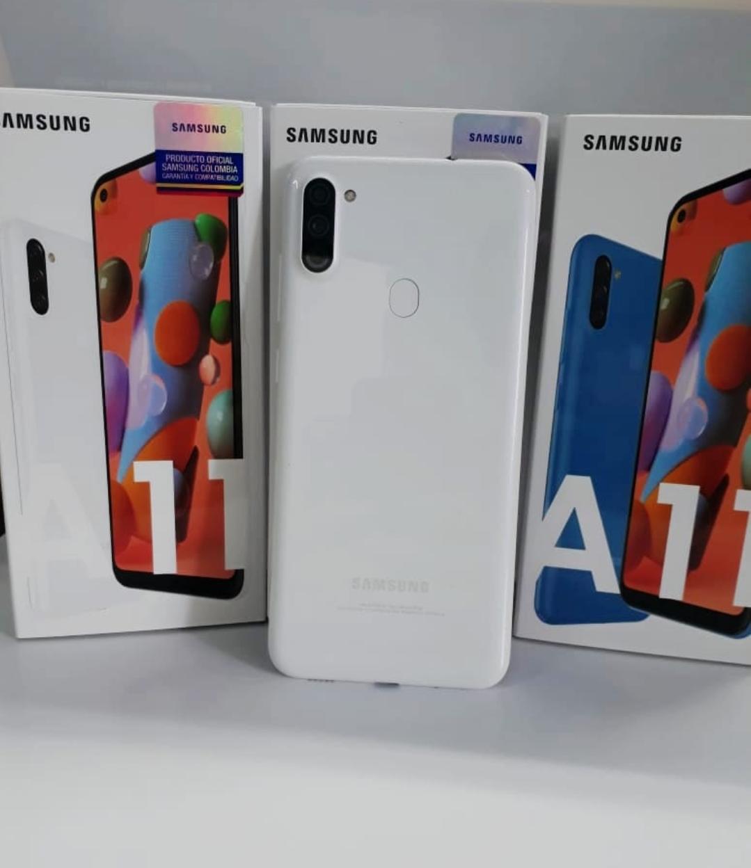 Person holding an iPhone in front of a MacBook Person holding an iPhone in front of a MacBook