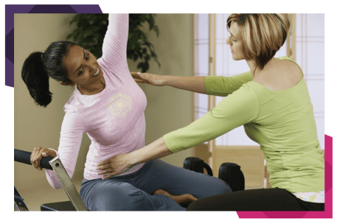 Woman Exercising With Personal Trainer