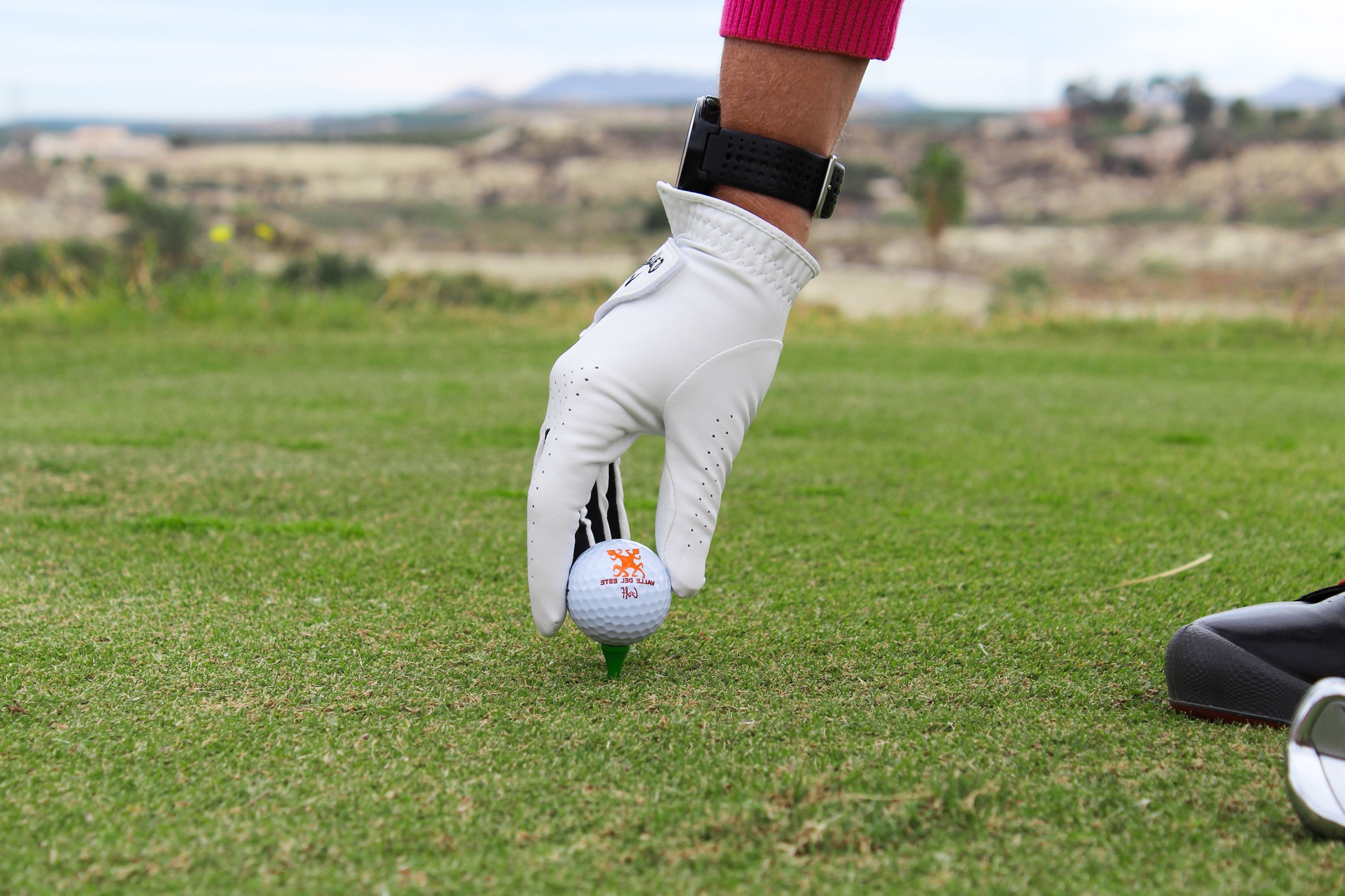 white golf ball on green grass field during daytime