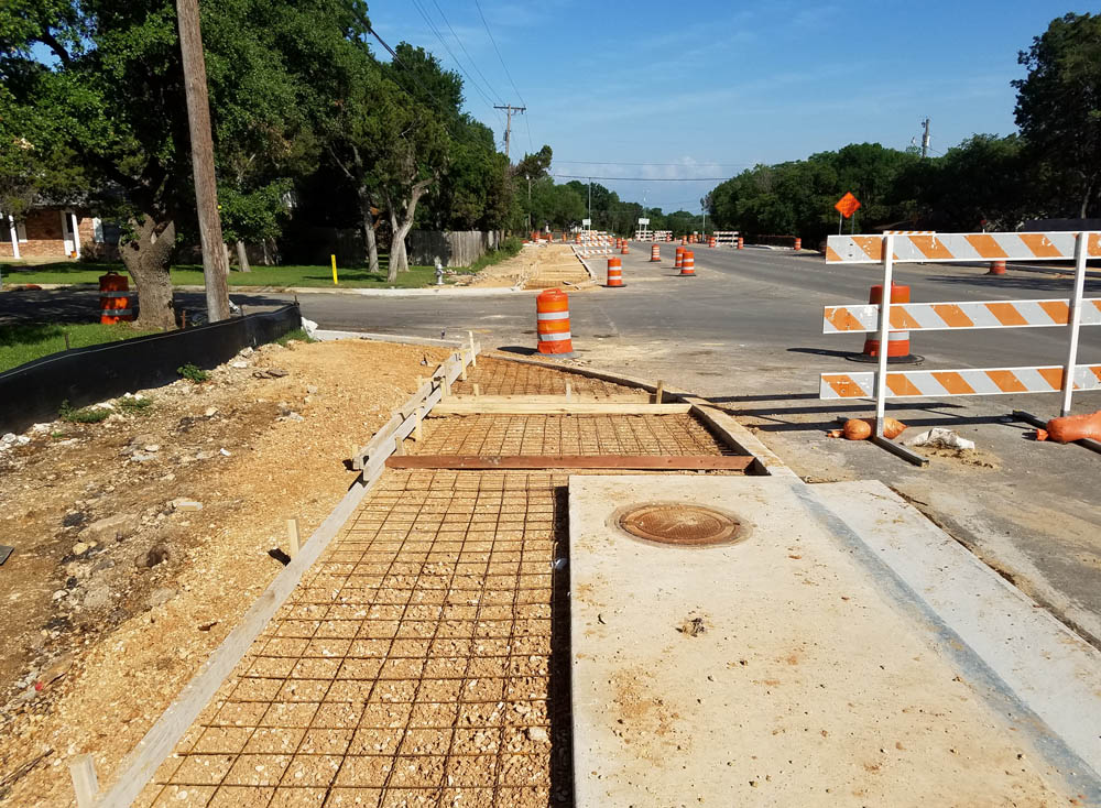 Partial sidewalk construction.