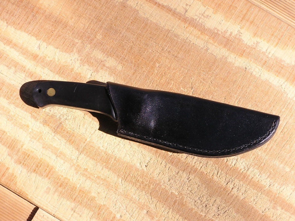 Black KN1 knife case shown with a knife inserted.