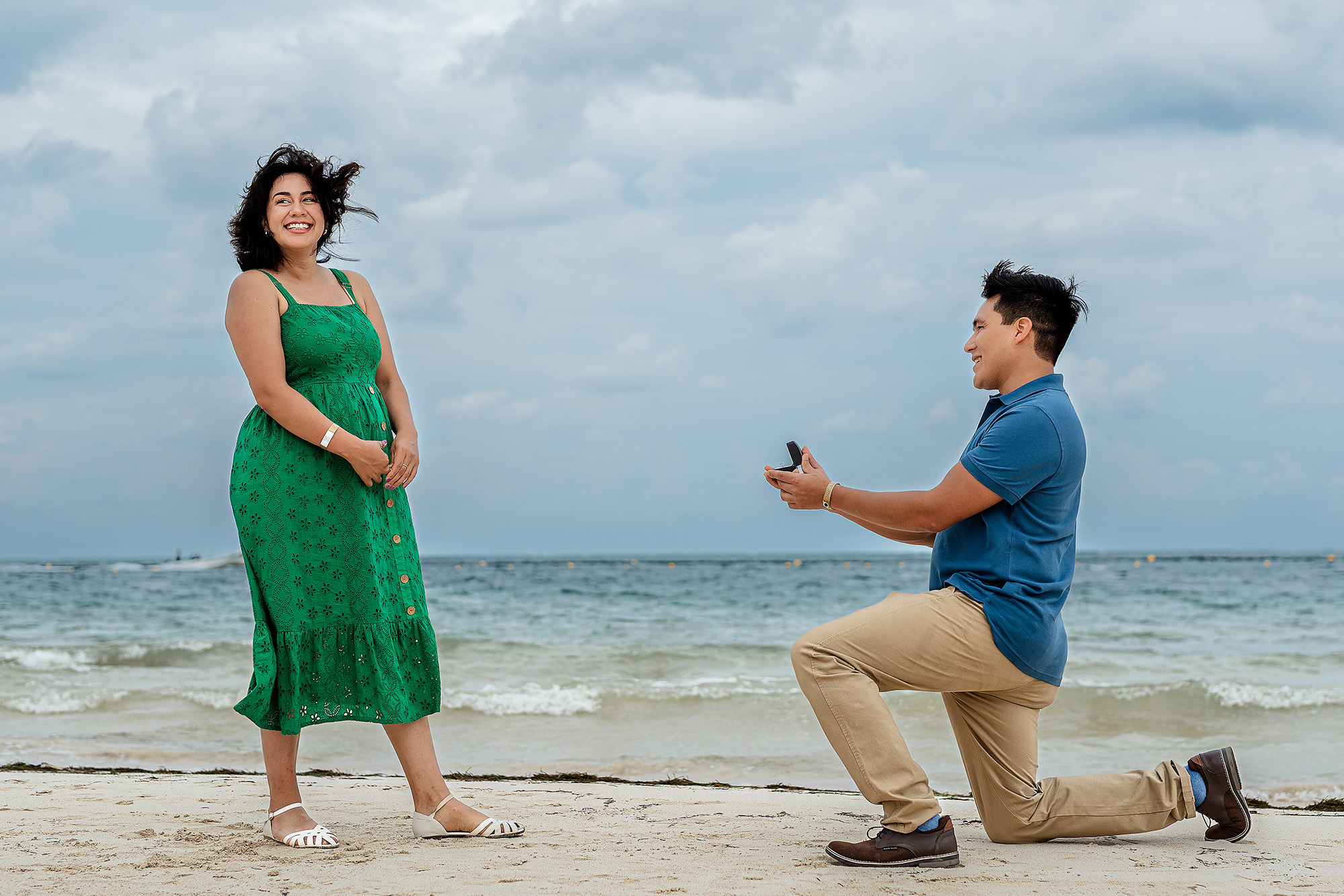 Candid engagement moment during a destination proposal session in the Riviera Maya.