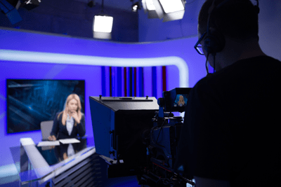 Female TV Director at Editor in Studio.