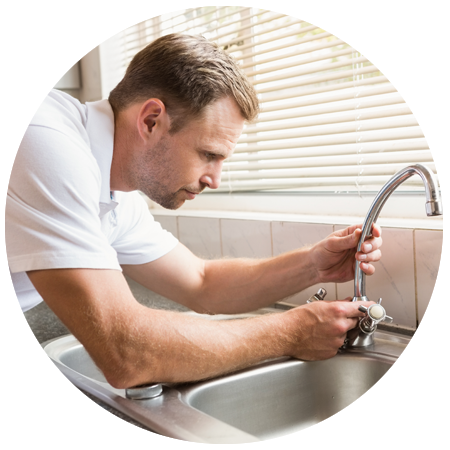 Man Fixing Tap With Pliers