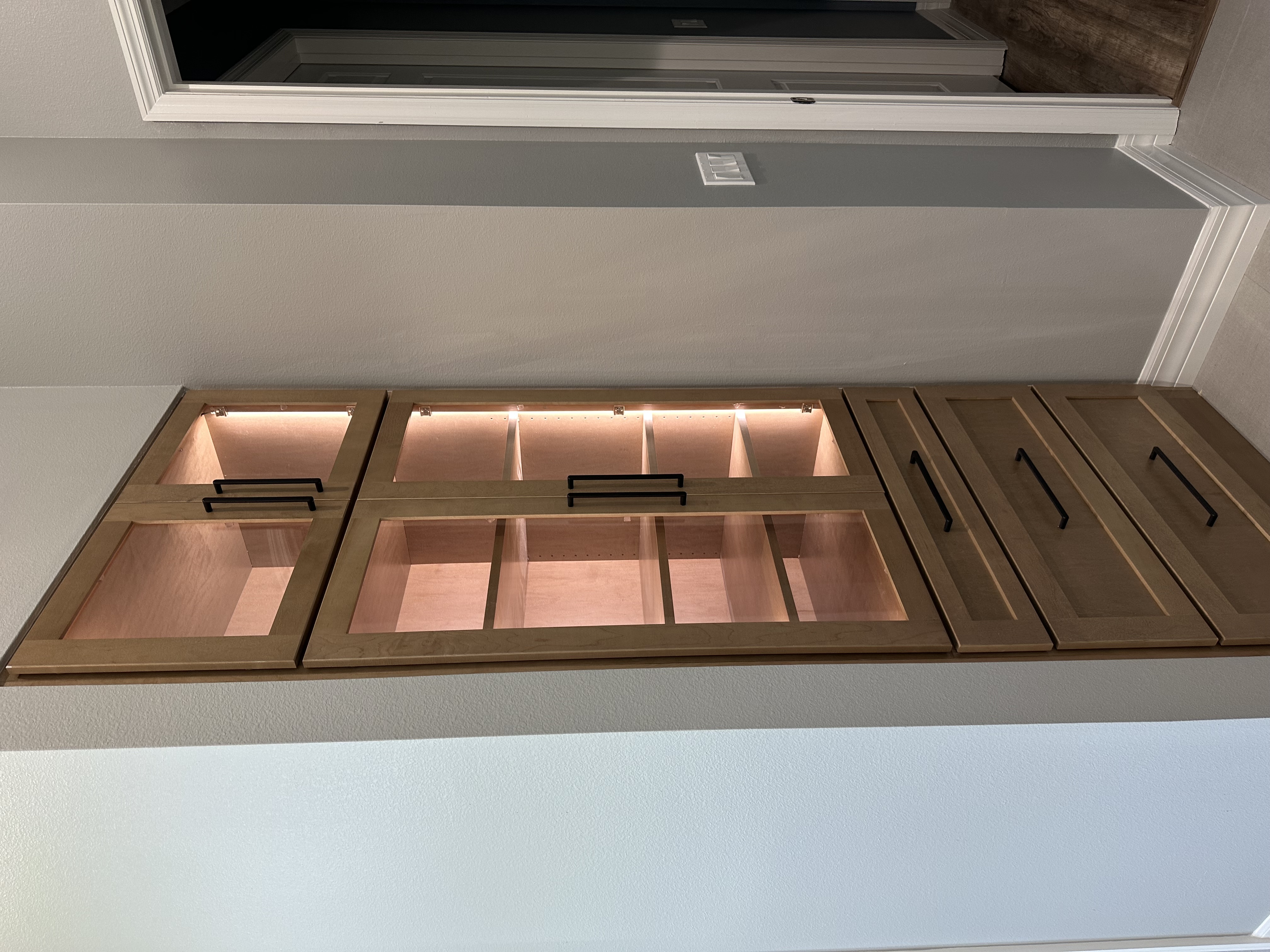 Sleek, matching linen cabinetry adds plenty of extra storage and fits perfectly into the space—both stylish and super functional.