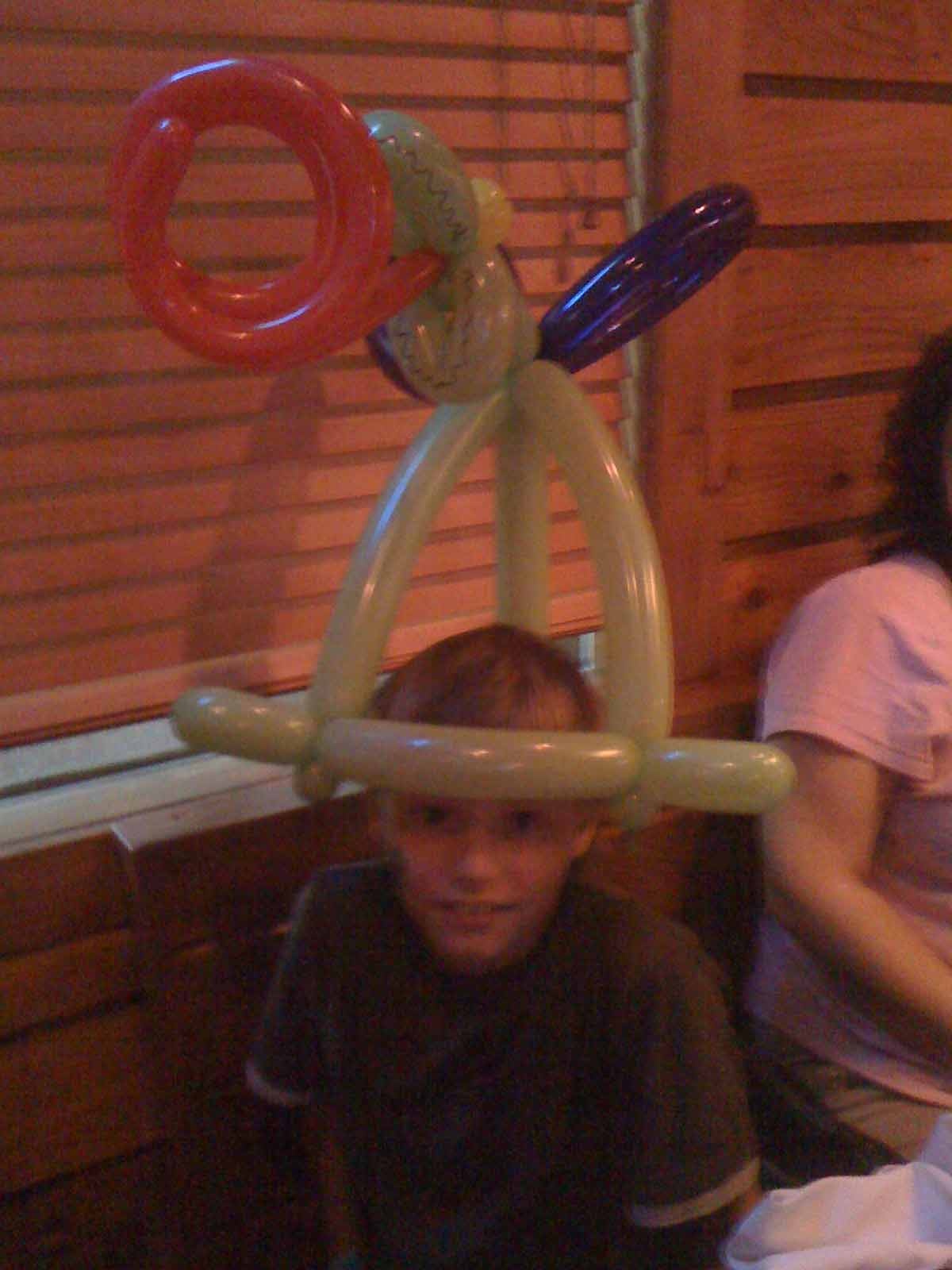 Kid With a Balloon Hat