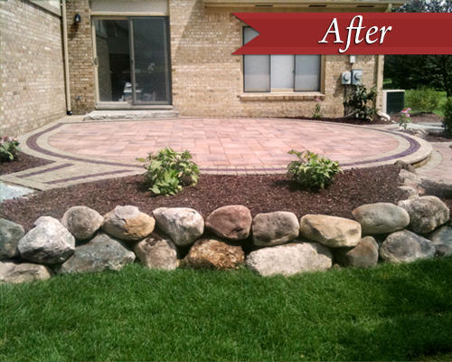 Bushes and boulders offer a finishing touch to the custom patio